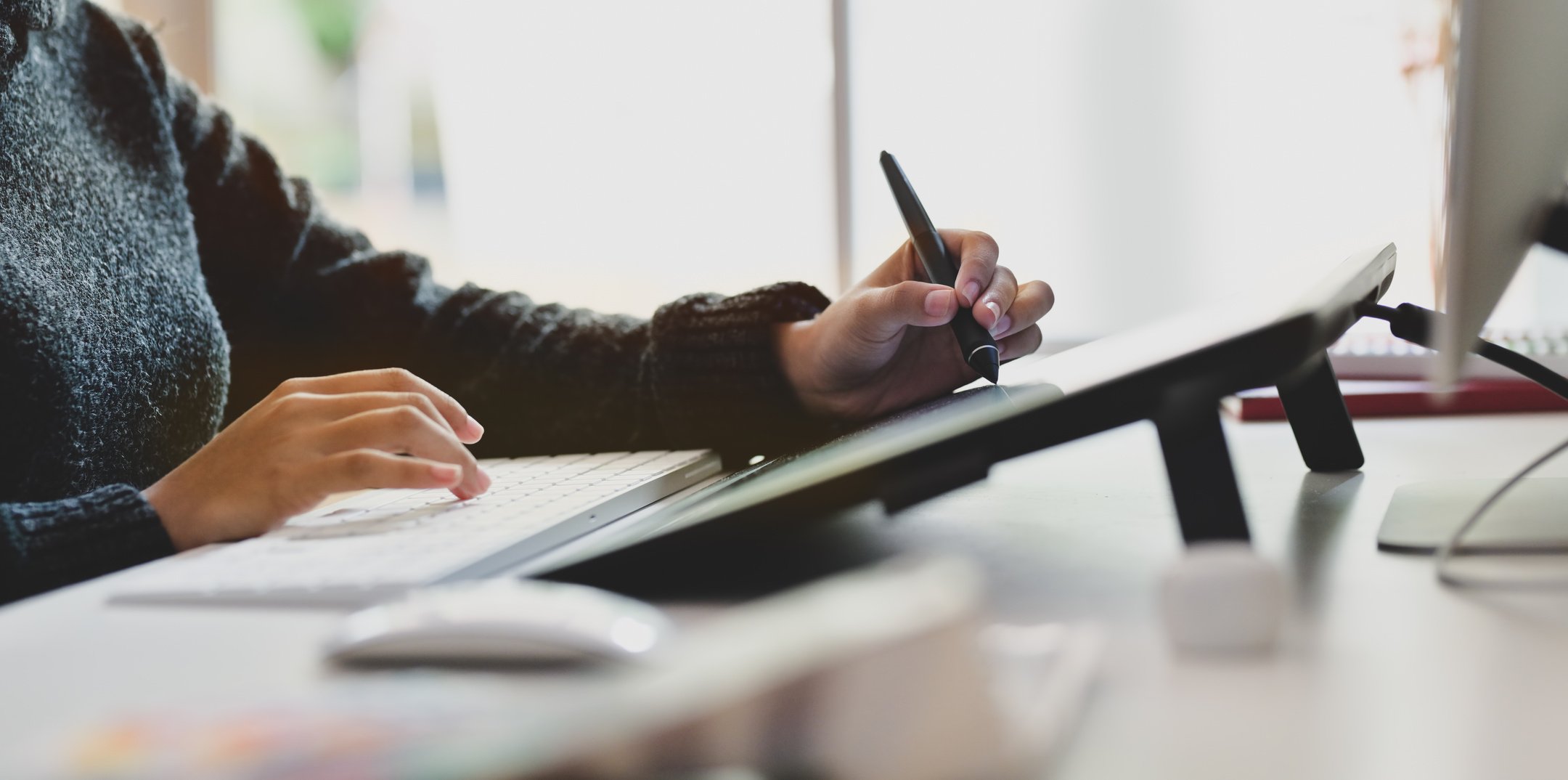 Photo of Person Writing On Tablet